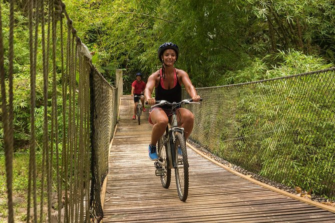 Rainforest Cycling Adventure in St. Lucia - Through botanical gardens, river trails, and a wooden bridge