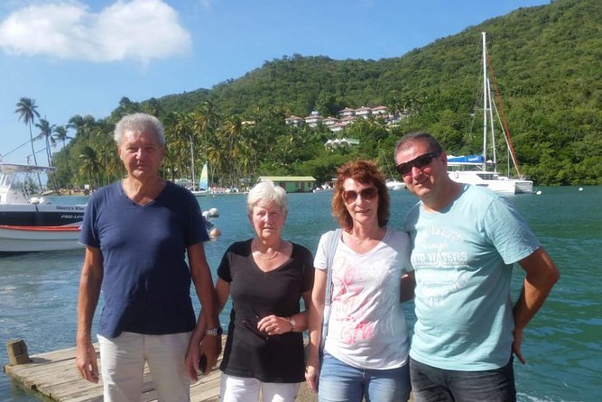 Trip to Soufiere: Volcano, Twin Pitons, Waterfall, Mud Bath & Botanical Garden - Rum, local art, and ordinary island life